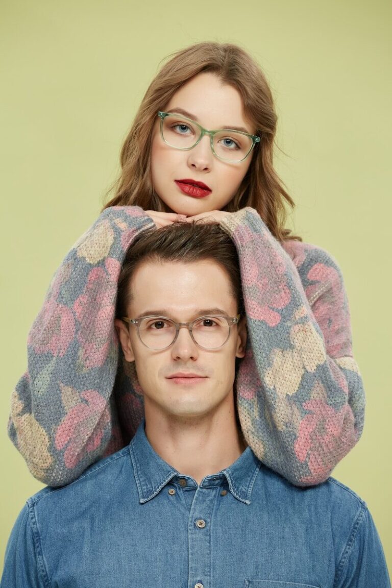 A man and a woman are standing behind each other