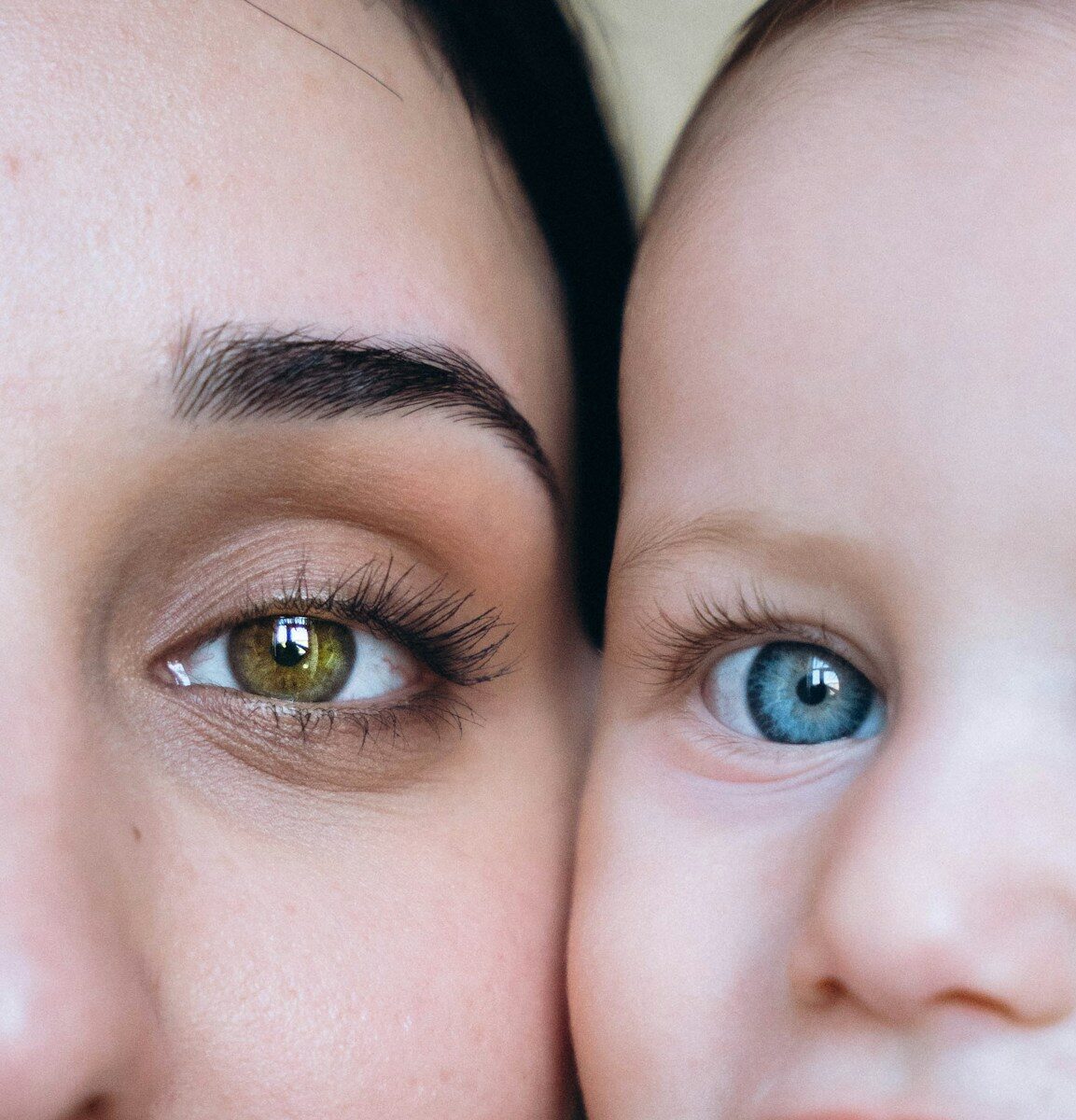 A close up of a woman holding a baby